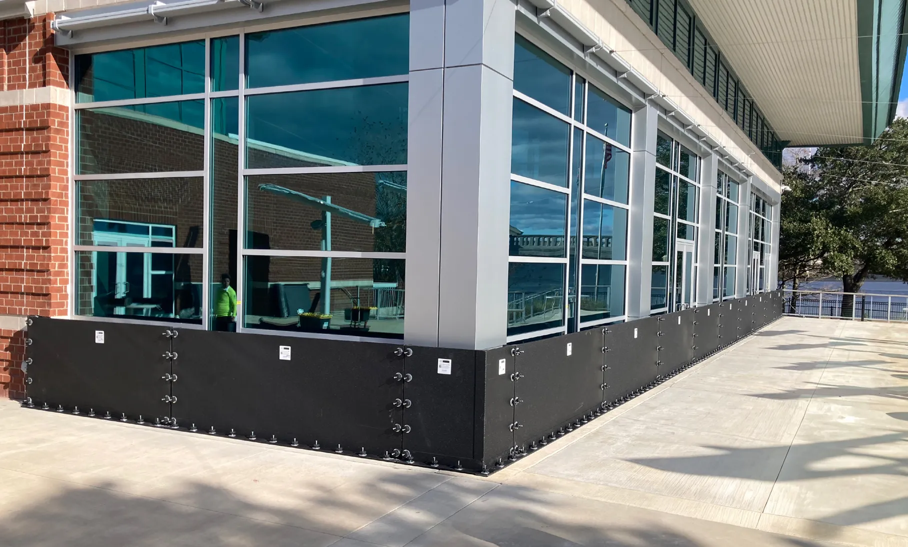 Dry floodproofing flood panels installed on a commercial building